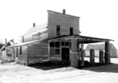 When this photo of the Keene Grocery was taken in the 1950s, the store had gas pumps very near the edge of K-4 Highway. By this time, the east addition to the store was just a one-story structure.
