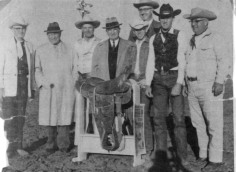 Cecil "Whitey" Butts won the all-around cowboy Trophy Saddle at the 1959 Independence Missouri Police Rodeo. Pictured left to right are Louis Howell, Bill Serman, E.C. Roberts, President Harry Truman, Whitey Butts, Ken Roberts and Mike Westwood with Les Milgrim in the background. Photo courtesy Whitey Butts.