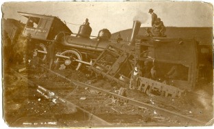 A small crowd of people inspect the wreck of a Rock Island locomotive at Maple Hill, Kansas in this photo dated November 12, 1900.