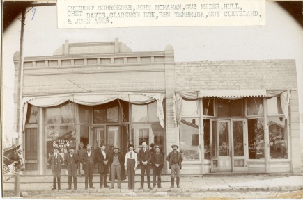 A group of Wabaunsee County men pose in front of "Johnnie Mac's" saloon in Alma, Kansas in this view, circa 1900.