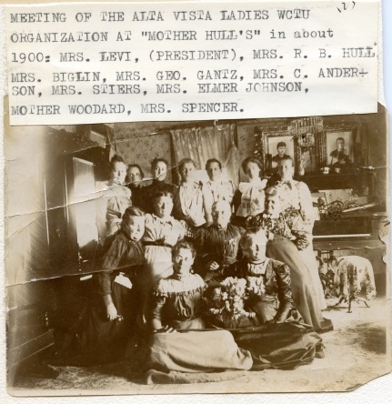 Members of the Alta Vista Woman's Christian Temperance Union pose for a photo at a club meeting held at "Mother Hull's" home in about 1900. Quite by coincidence, Mrs. Hull's husband, Dr. R. W. Hull is seen above with a group of his buddies posing in front of "Johnnie Mac's" tavern in Alma.