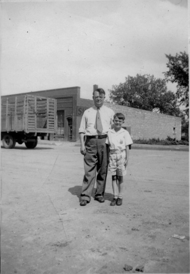 Preston Dunn, left, and Dean Dunn stand on Main Street in this view from the 1930s. Duff Produce is visible in the background.