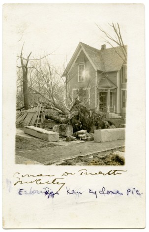 This real photo postcard from 1911 shows damage to Dr. Trivett's home at Eskridge, Kansas.