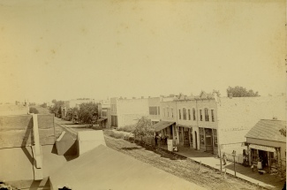 This Gus Meier View, circa 1893, looks to the northeast in the 200 block of Missouri Street. Louis Palenske's Alma State Bank was located in the south side of the Palenske Building, the second building from the right in this view. This would be the first home of the Alma National Bank.
