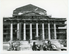 An estimated 85% of the buildings in Villach, Austria, suffered damage from British bombing during World War II. In this view, masons have constructed scaffolding on a damaged building.