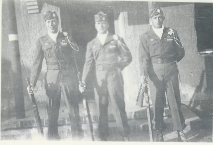 Pfc. Charlie Barnhart, far right, and two other members of the Escort Company stand at rest outside an American sector facility in Berlin in 1945.