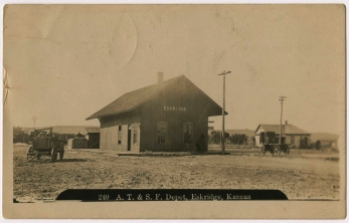 This real photo postcard by Zercher Photo in Topeka provides a view of the original MAB/ATSF depot at Eskridge, Kansas, before the depot was extended in length by 15-feet.