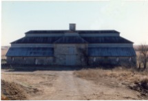 In this 1990 view of the Wiser Barn, one can see the outline of the stonework repair in the center section of the north side of the barn. A two-story section including the entry doors had collapsed.