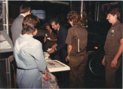 U. S. Congressman Jim Slattery cuts the first piece of cake at the 1987 UPS Founders' Day party at the Topeka UPS center.